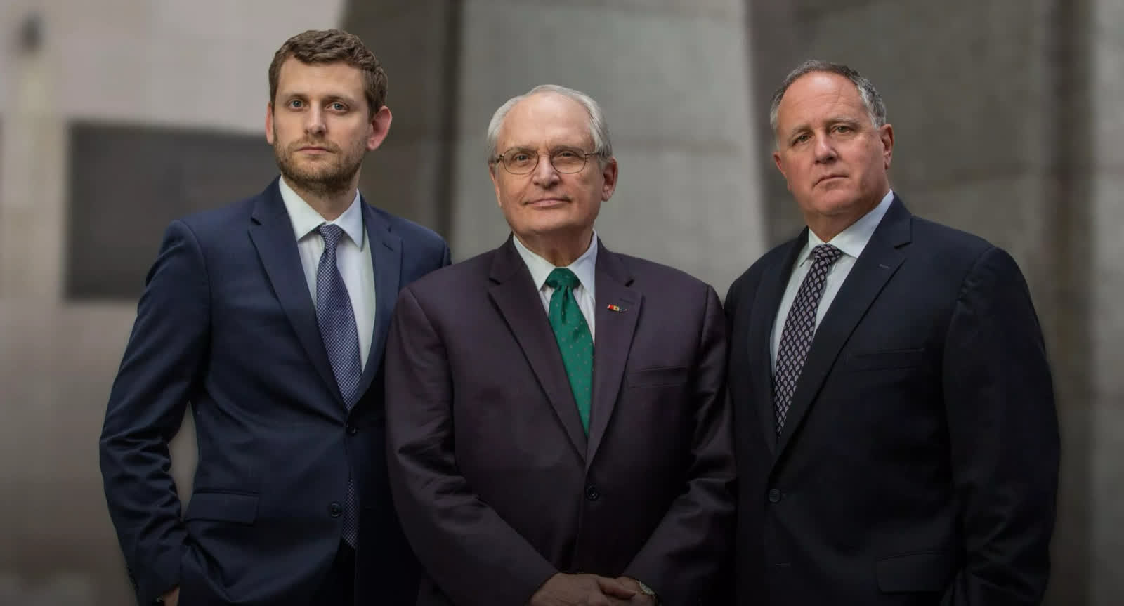Homepage header; alt text names the firm's lawyers, but check whether it shows people or a skyline
