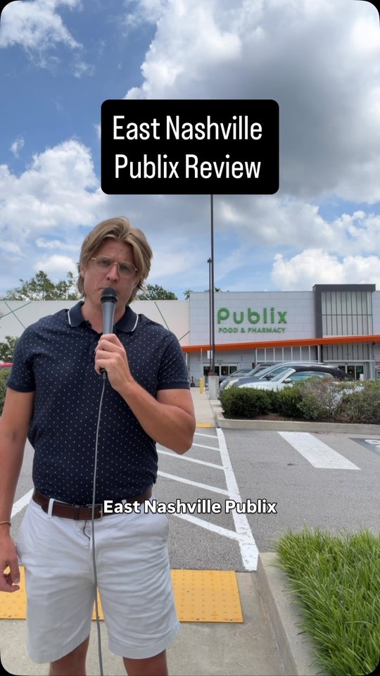 Our host with a microphone outside the East Nashville Publix